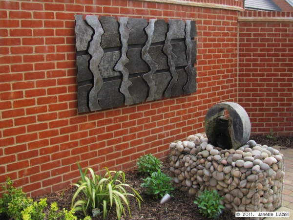 Sculpture-wall hanging in garden-view 2 Sculpture-wall hanging in garden-view 1